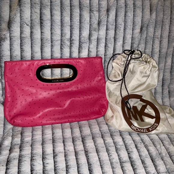 pink leather clutch bag